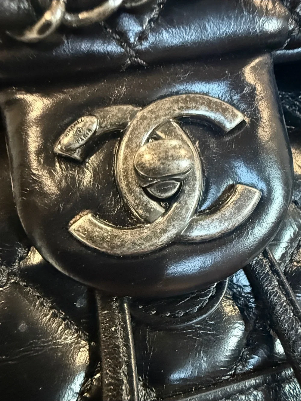 CHANEL Black Quilted Lambskin Drawstring Backpack with Chain